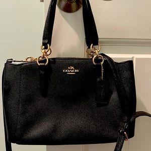 Small Coach bag. Never been used does not come with a dust ruffle. It was a gift